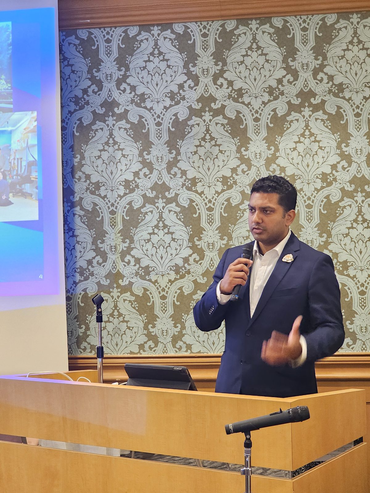 Speaking at a podium