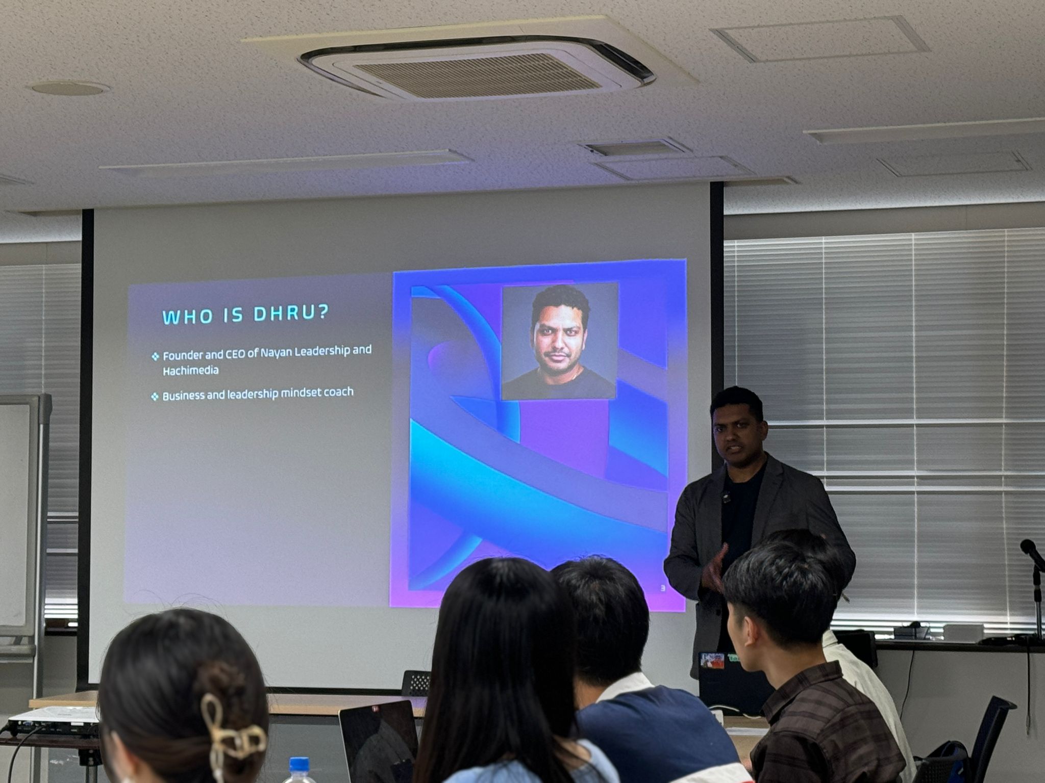 Dr. Dhru presenting to leaders in Tokyo
