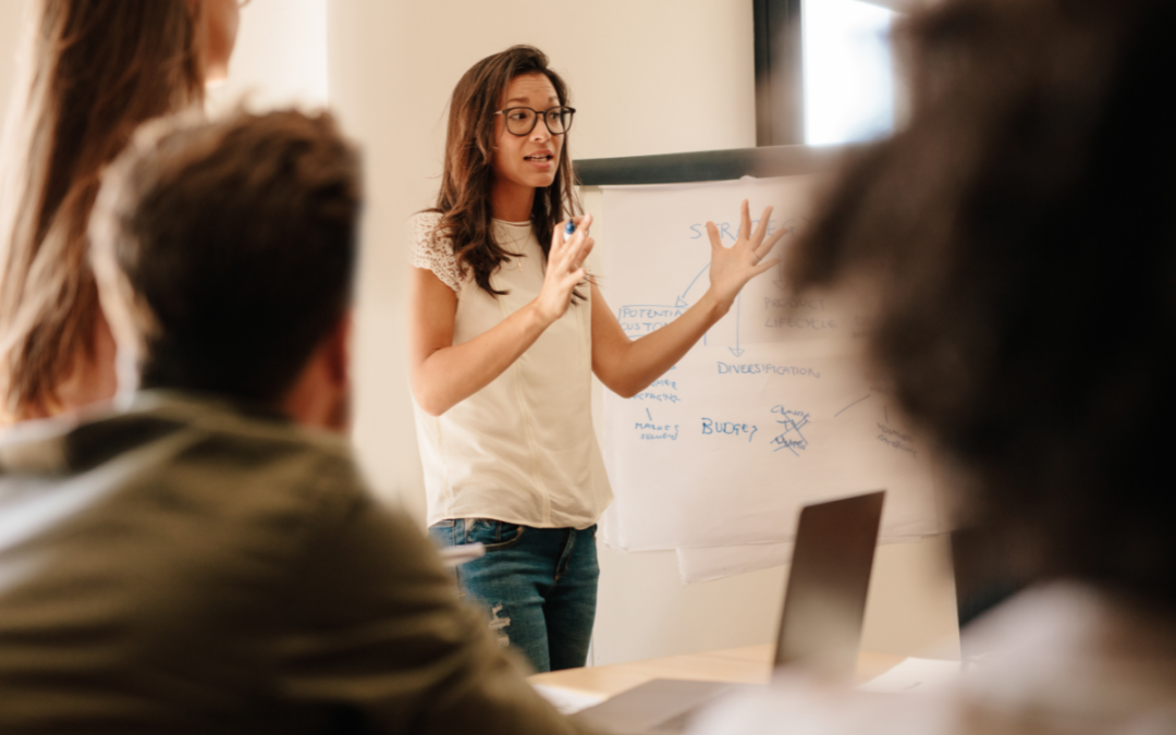 female leader giving a presentation to a group